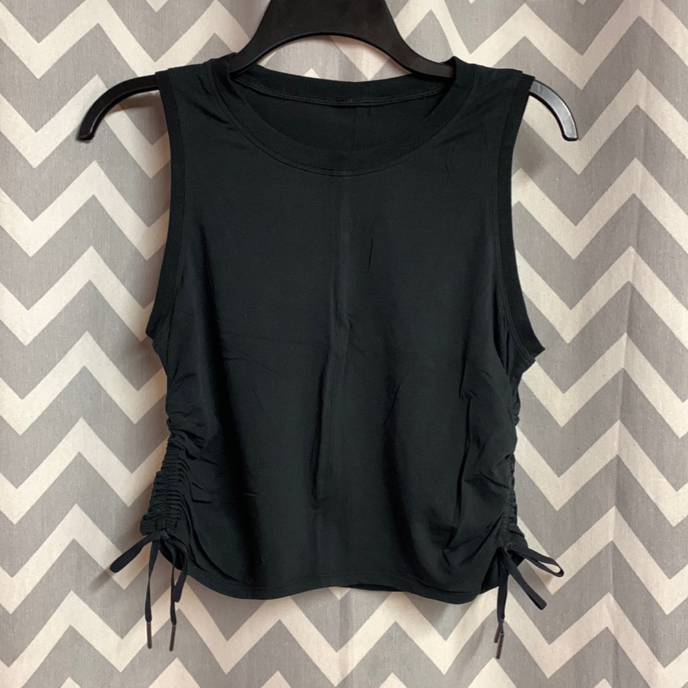 Super cute Lululemon tank! Cropped and ties up the side are adjustable